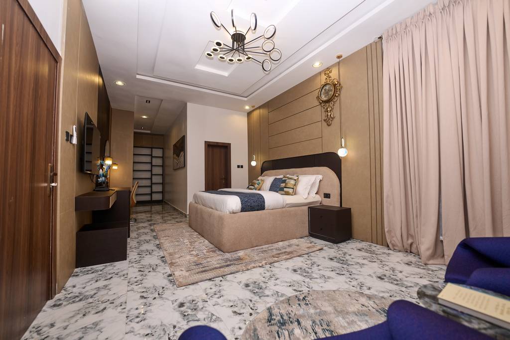 The Executive Lodge living room at The 1% Manor